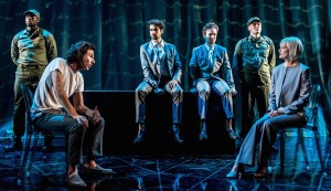 William Postlethwaite as John the Savage and Sophie Ward as Margaret Mond, and in the background, Theo Ugundipe as a guard, Scott Karim as Helmholtz Watson, Gruffud Glyn as Bernard Marx and David Burnett as a guard. Pic by Manuel Harlan